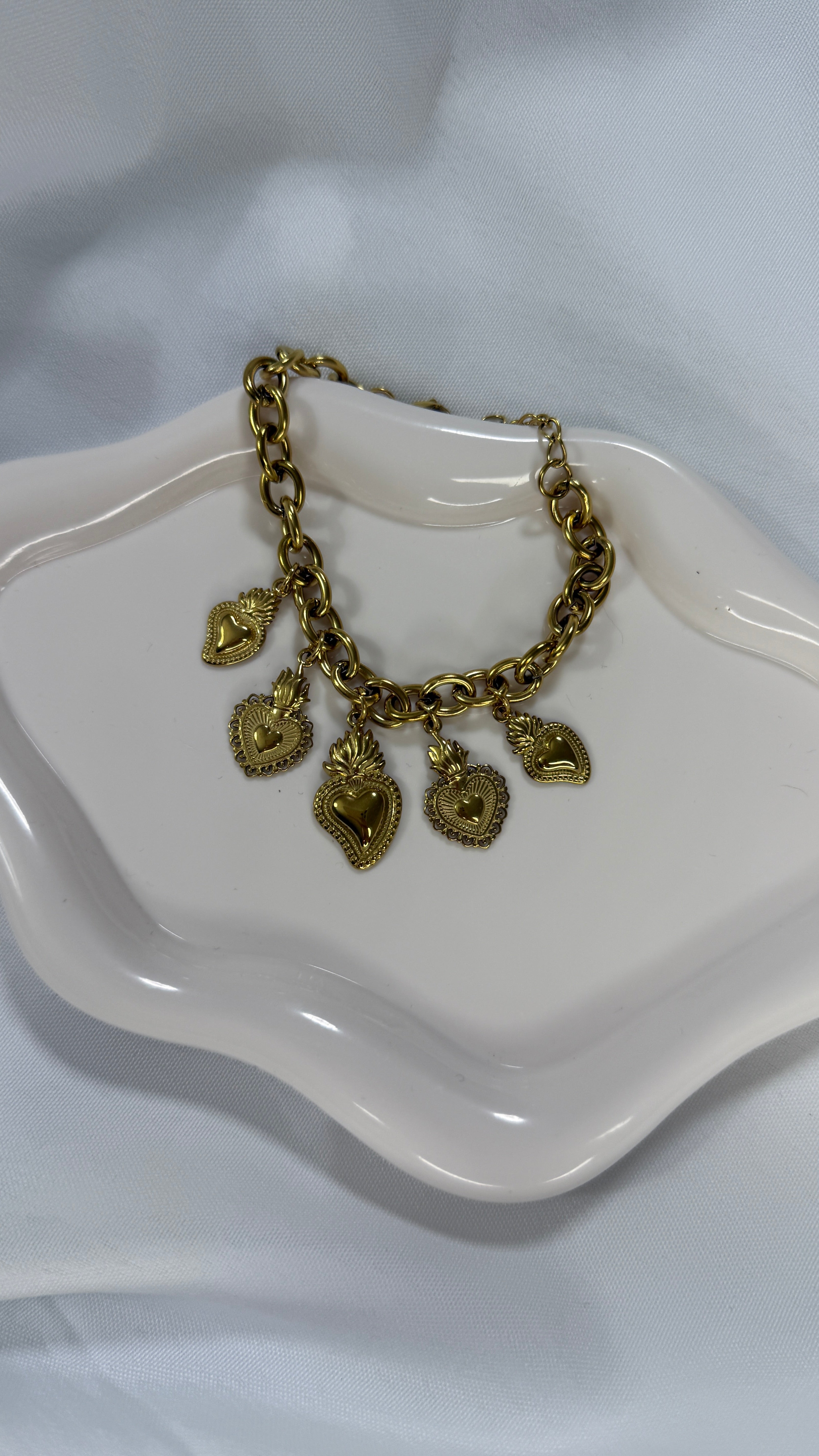 Bracciale multicharm cuore sacro gold