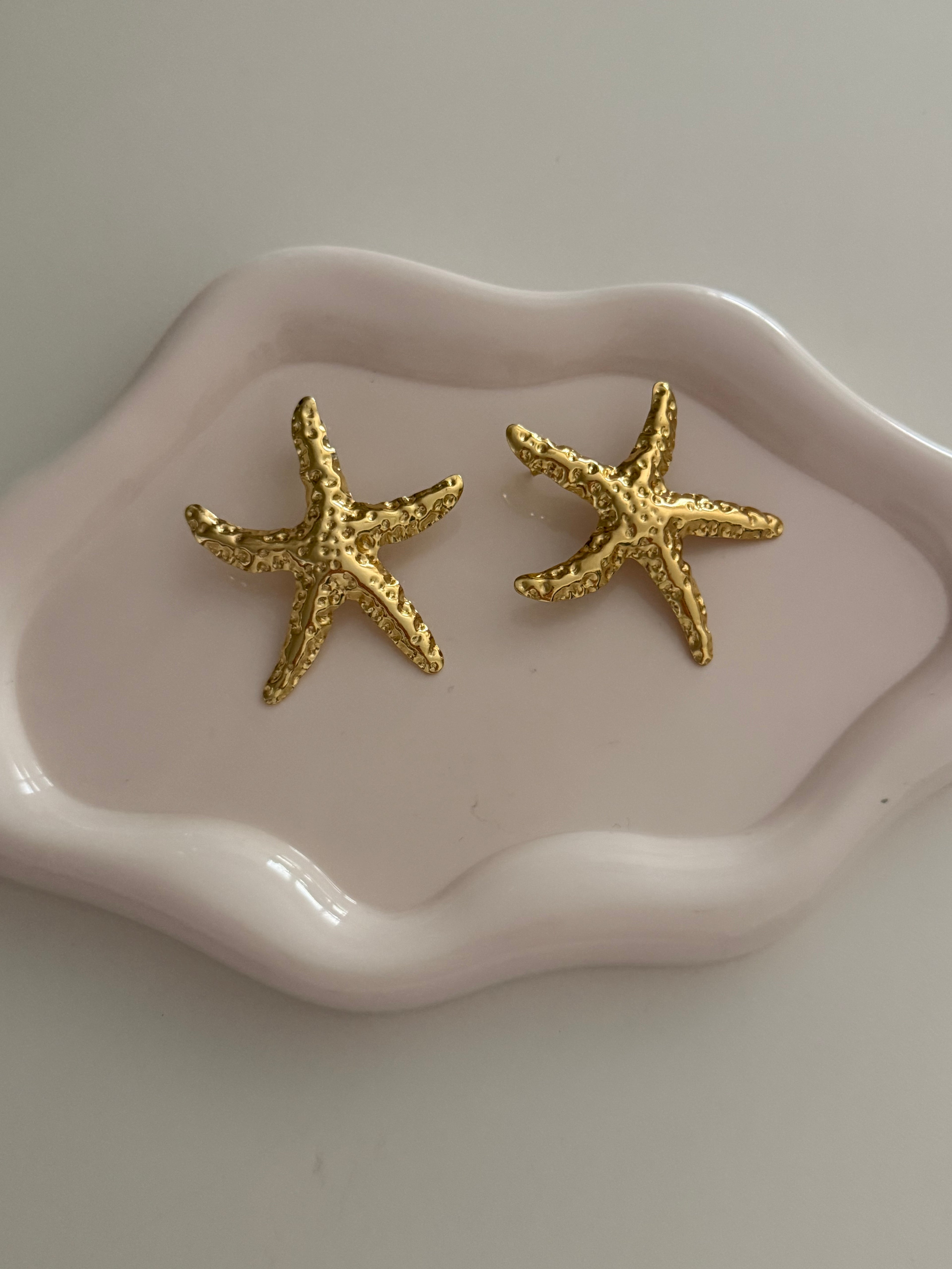 Orecchini stella gold