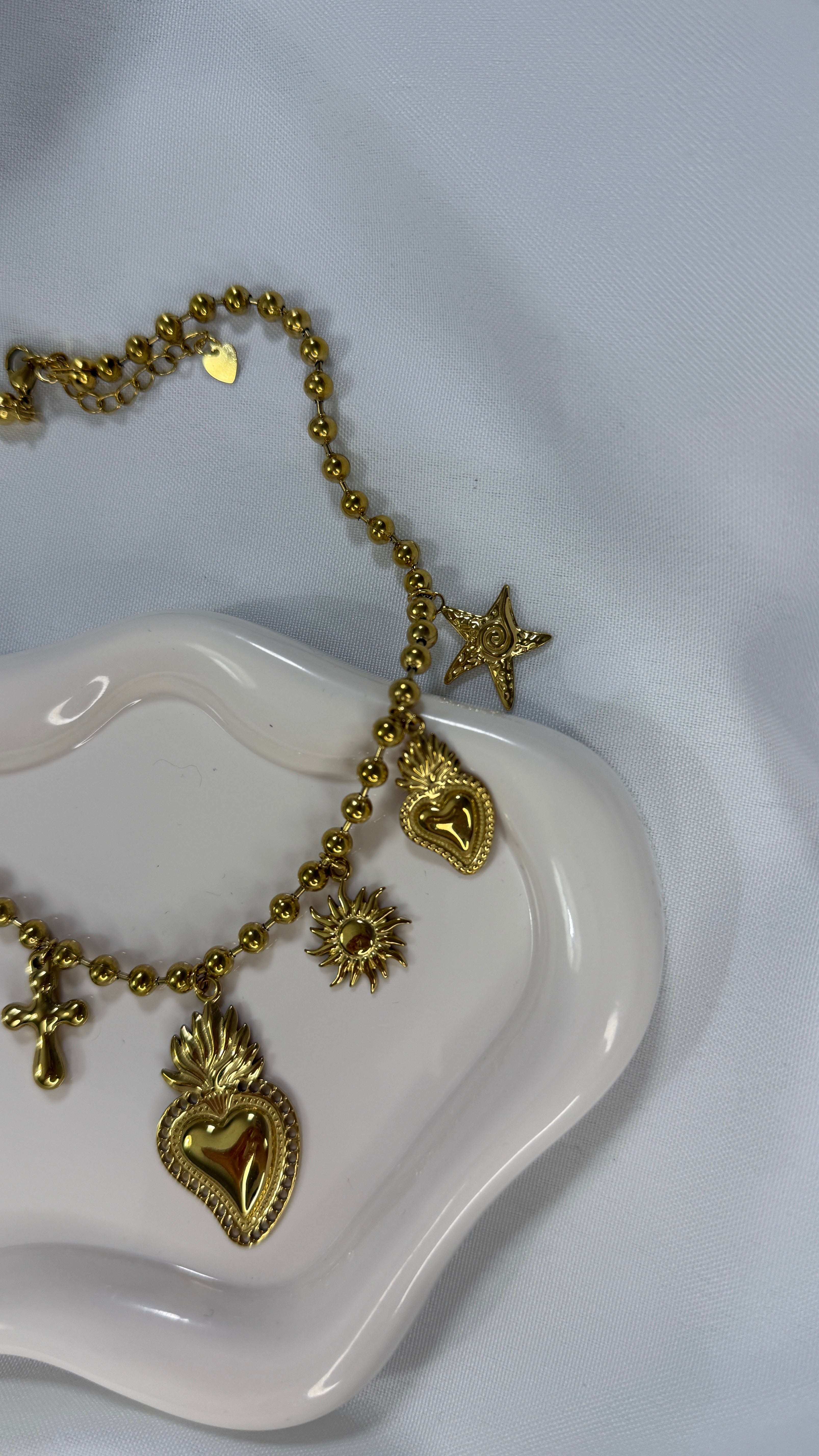 Collana gold multicharm cuore sacro