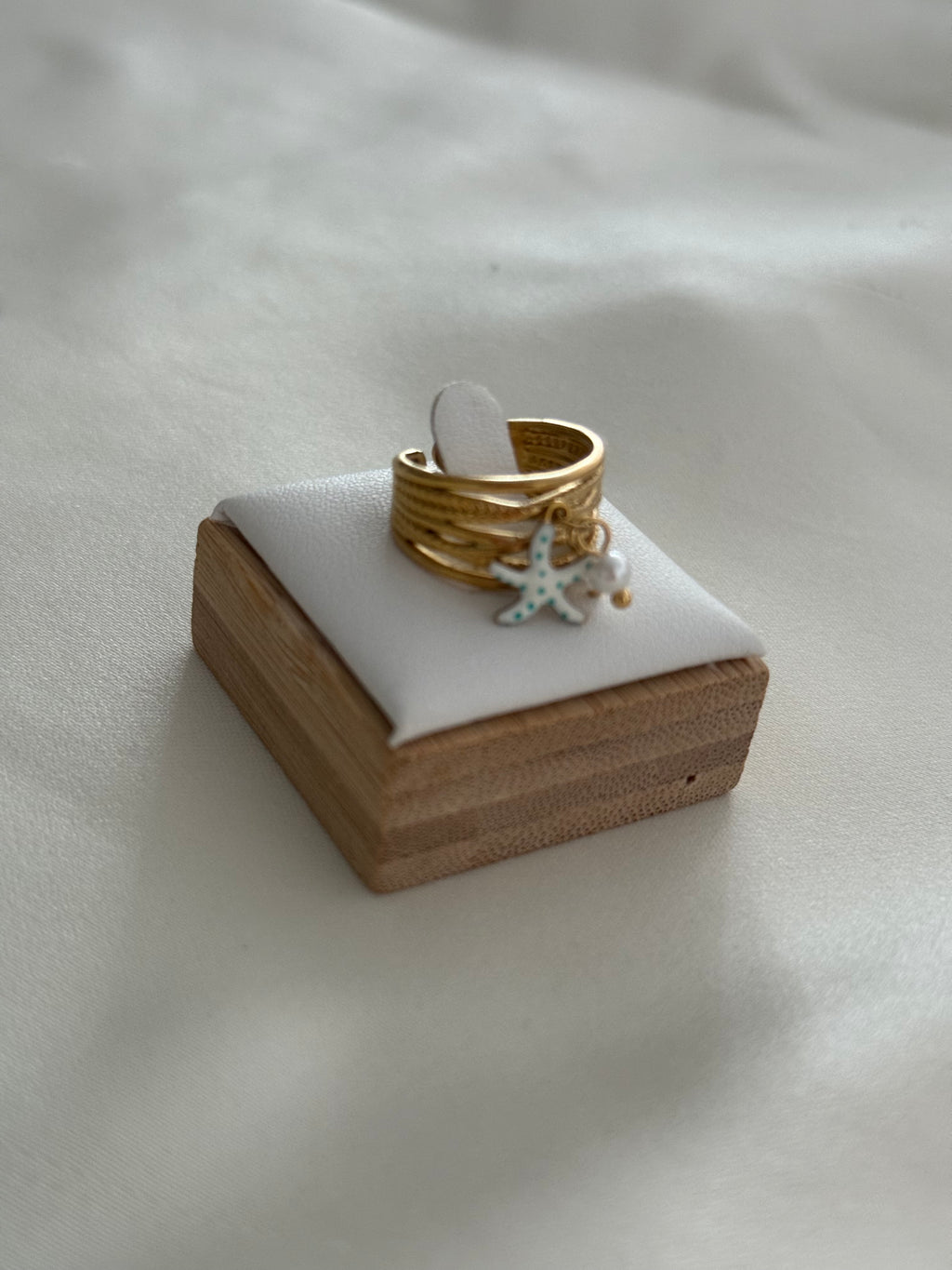 Anello stellina pendente